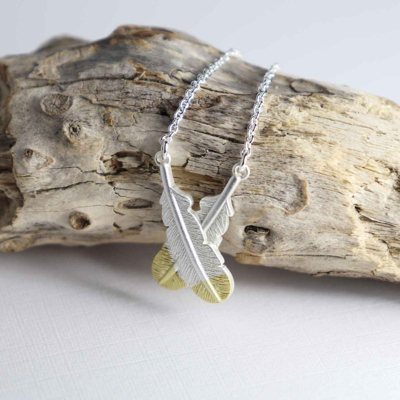 LITTLE TAONGA CROSSED FEATHER NECKLACE